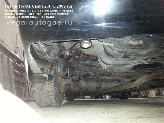 заправочное устройство в заднем бампере, слева Установка ГБО Digitronic на Toyota Camri 2009 г.в., 2.4 л., 167 л.с., 60-литровый цилиндрический баллон в багажнике Нижний Новгород, Дзержинск